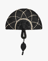Woven handheld fan with intricate pattern and looped handle design.