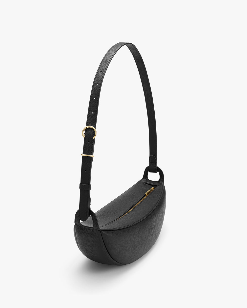 Minimalist shoulder bag with adjustable strap and zippered closure.