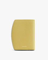 Rectangular leather wallet with curved edge and subtle text.