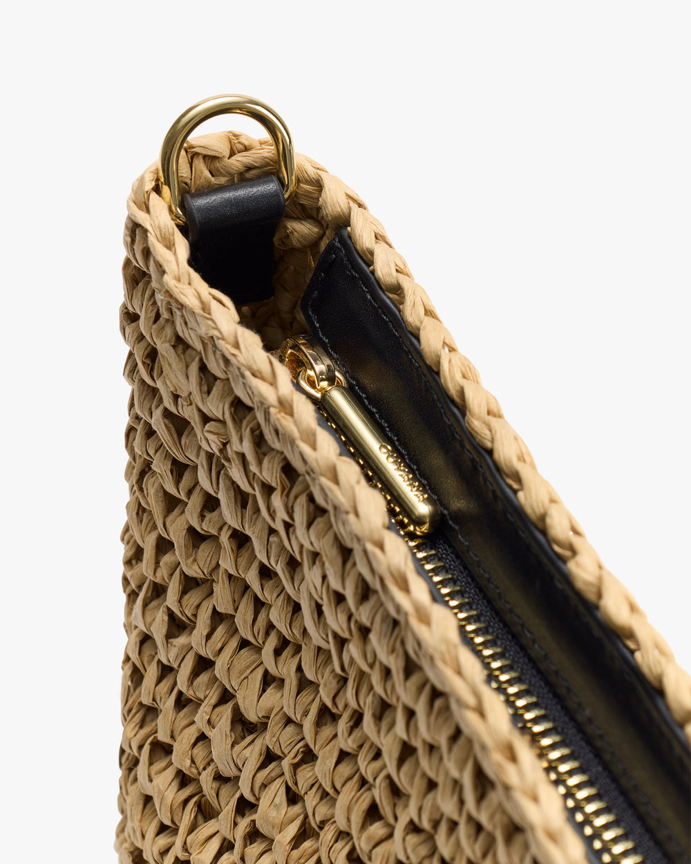 Woven bag with zipper and metal ring detail on the corner.
