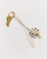 Keychain with keys and a looped decorative leather piece.