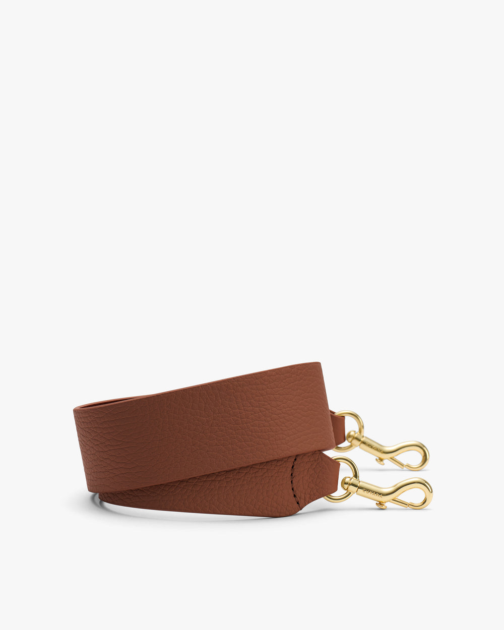 Bag strap with gold clips on a white background.
