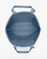 Open tote bag with two handles and inner pocket shown from above.