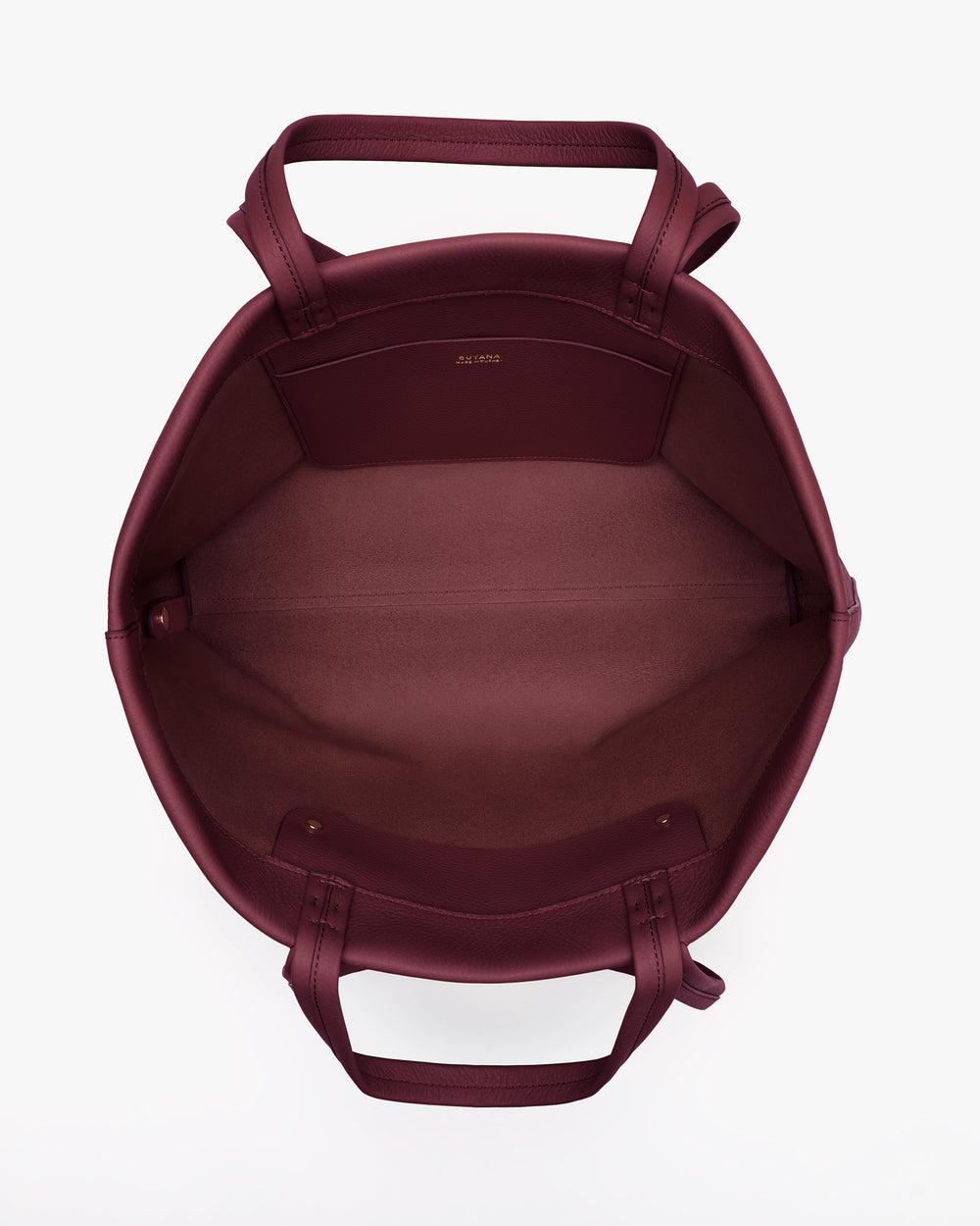 Open tote bag with handles facing upwards.