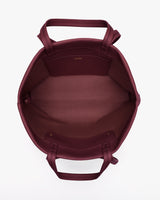 Open tote bag with handles facing upwards.