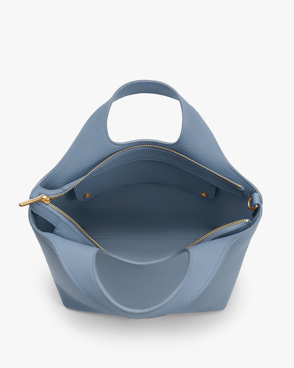 Open handbag with zippered pocket and handles.