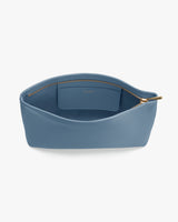 Open pouch with a zippered top and a small interior pocket.