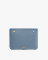 Rectangular clutch with two metal studs at the top.