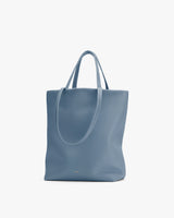 Large tote bag with two handles and minimal design.