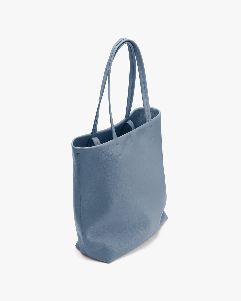 Simple tote bag with two handles standing upright.