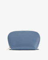 A rounded toiletry bag with a zipper on top.