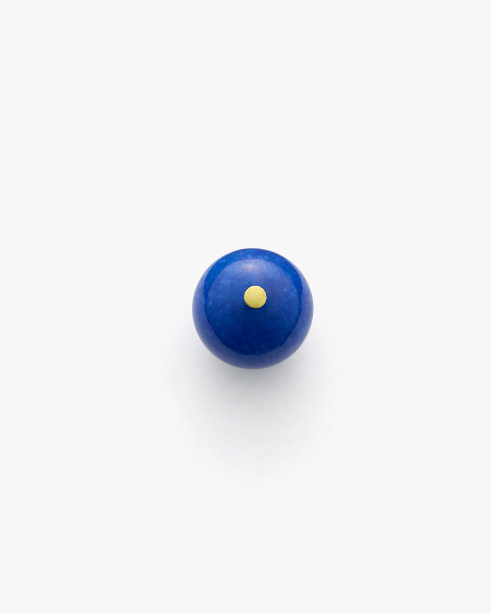Round object with a small dot centered on top.