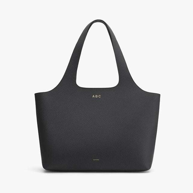 Personalized tote bag with handles and visible initials ABC on it.