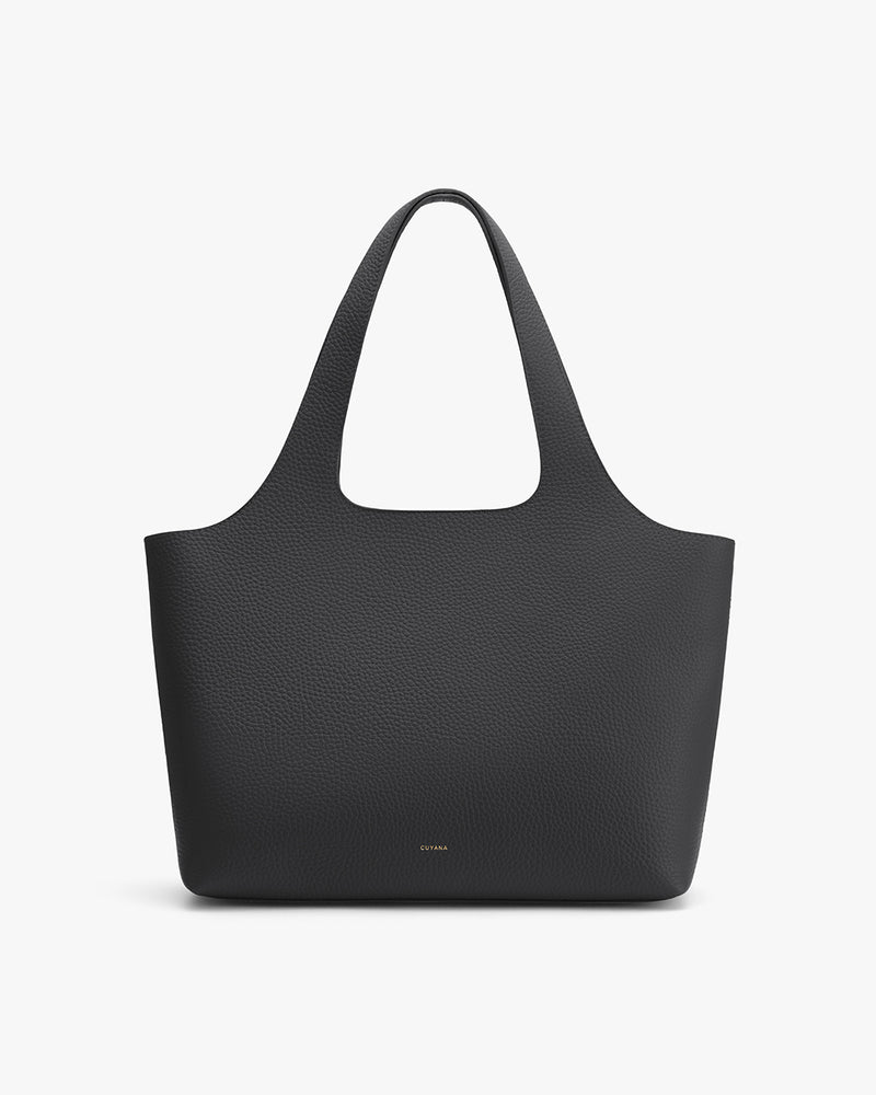 A large tote bag with two handles standing upright.