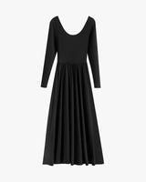 Long-sleeved dress with a deep neckline and pleated skirt.