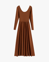 Long-sleeved dress with a deep neckline and pleated skirt.