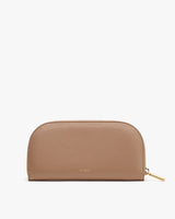 A minimalist, half-circle clutch with a zipper closure.