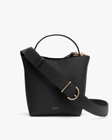 Handbag with a wide strap and a gold buckle