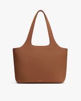 Large tote bag with simple, sleek design and wide handles.