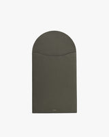 Rectangular leather laptop sleeve with a curved flap closure.