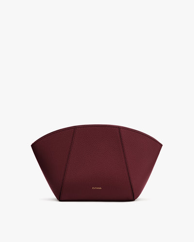 Pouch with a wide base and curved top
