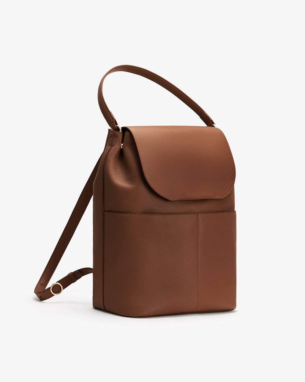 Minimalist backpack with a top handle and front flap, featuring side pocket and adjustable straps.