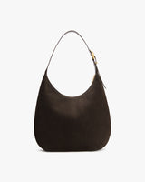 Shoulder bag with a curved shape and adjustable strap