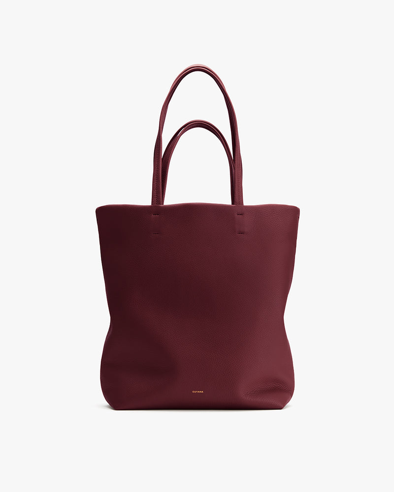 A tote bag with two handles displayed upright.