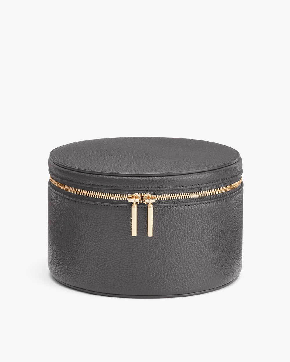 Round zippered case with a metallic zipper pull.