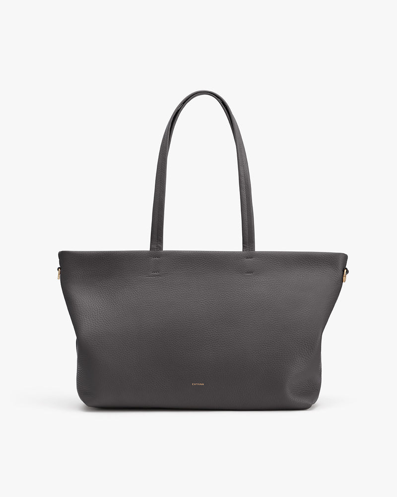 Large tote bag with two handles on a plain background