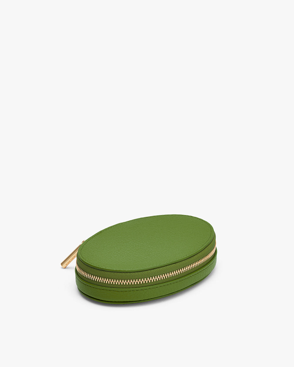 Small oval case with zipper closure on a plain background.