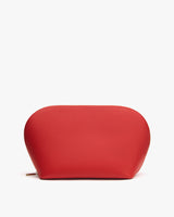 Rounded zippered pouch with minimal design.