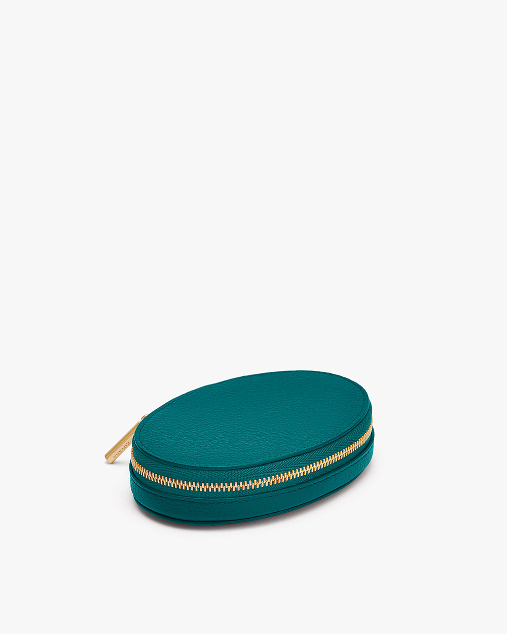 Small oval zippered pouch on plain background