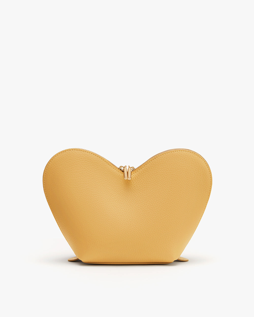 Heart-shaped purse standing upright on a flat surface.