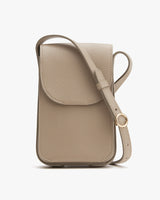 Small vertically oriented shoulder bag with strap and front flap closure.