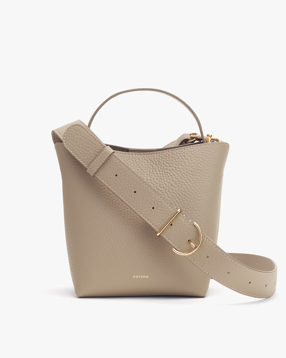 Handbag with a shoulder strap and metal buckle on a plain background.
