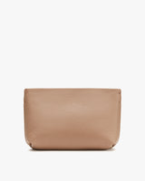 Leather pouch against a plain background