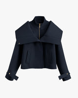 Short jacket with wide collar and zip closure.