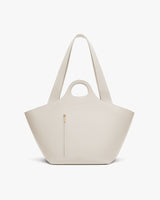 Large tote bag with short handles, long straps, and a front zipper pocket.