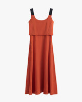 Sleeveless dress with black shoulder straps and a layered bodice.