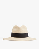 Straw hat with wide brim and ribbon band on white background.