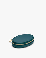 Small oval-shaped zippered case lying flat