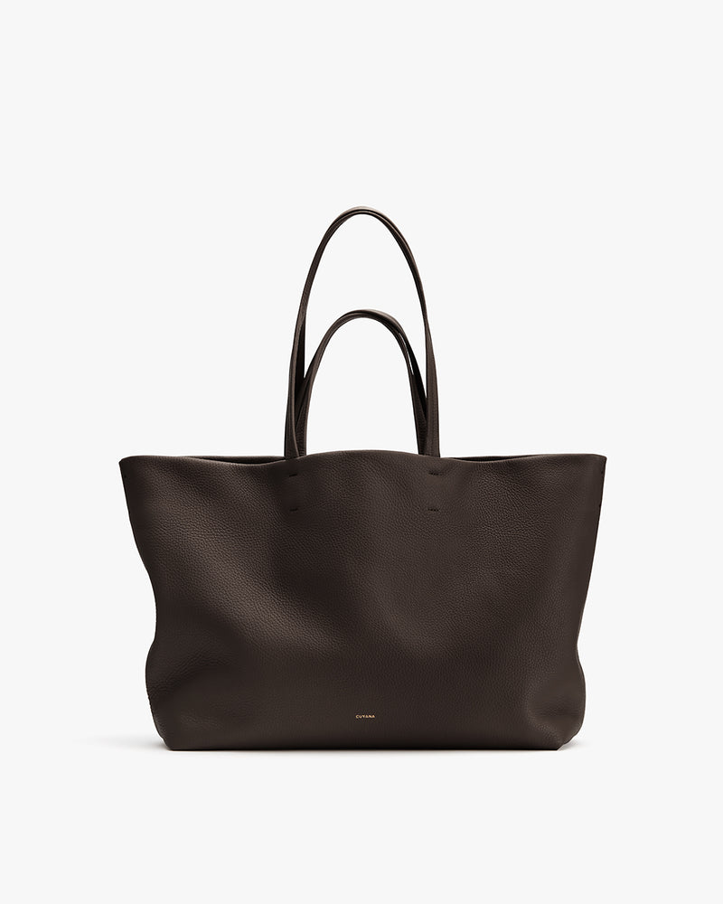 Large tote bag with dual handles on display.