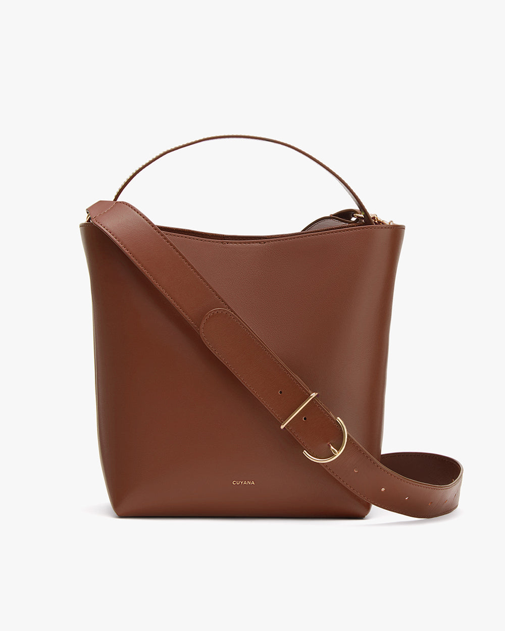 Brown bucket bag with a wide strap and a handle.