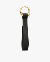 Leather keychain with a loop and gold ring.