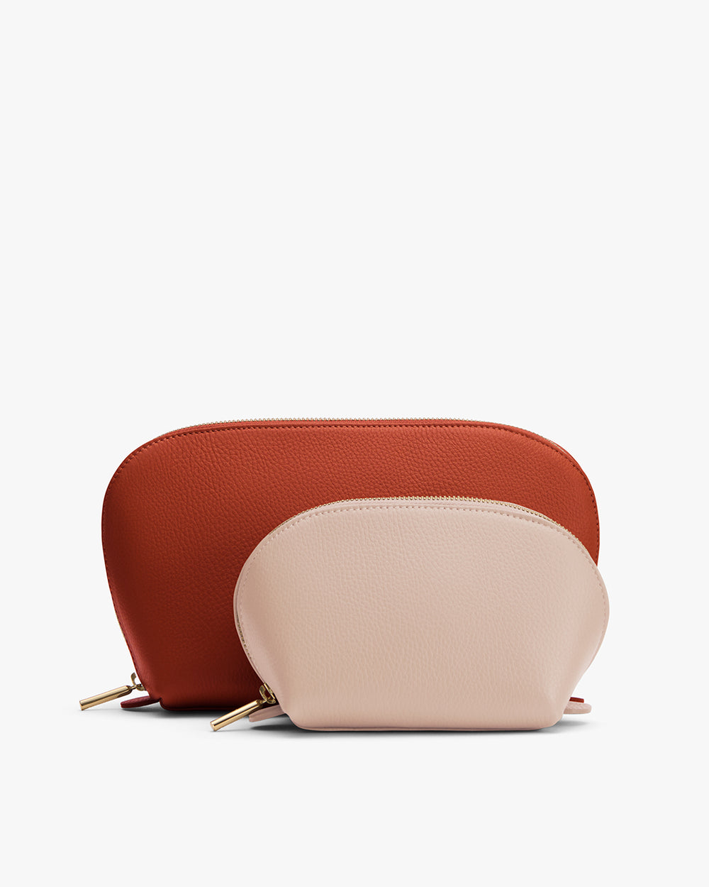 Two leather pouches, one larger and one smaller, with zippers, on a flat surface.