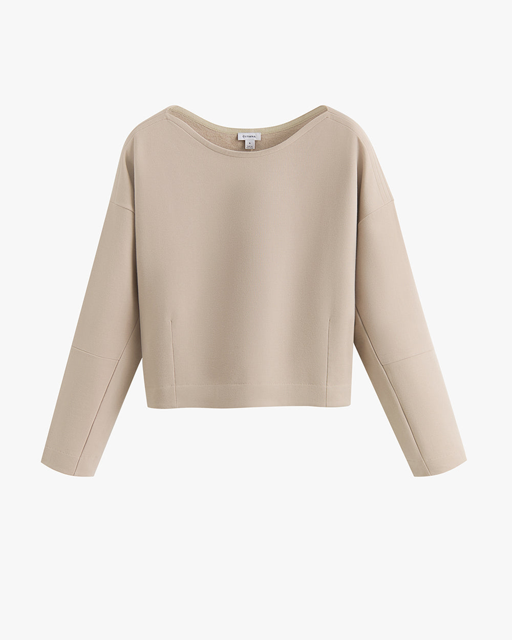 Long-sleeve casual top with loose fit and wide neckline on hanger.