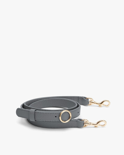 Shoulder strap with gold clasps and circular ring attachment