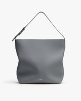 Shoulder handbag with structured design and minimalist style.