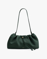 Handbag with gathered design and shoulder strap.